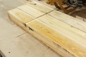 dado blade grooving system for wood packaging production