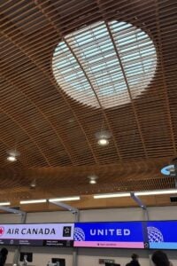 Mass timber ceiling with skylight detail in airport terminal